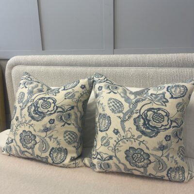 Two cushions in blue patterned fabric