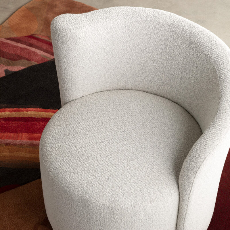 Curved accent chair in boucle
