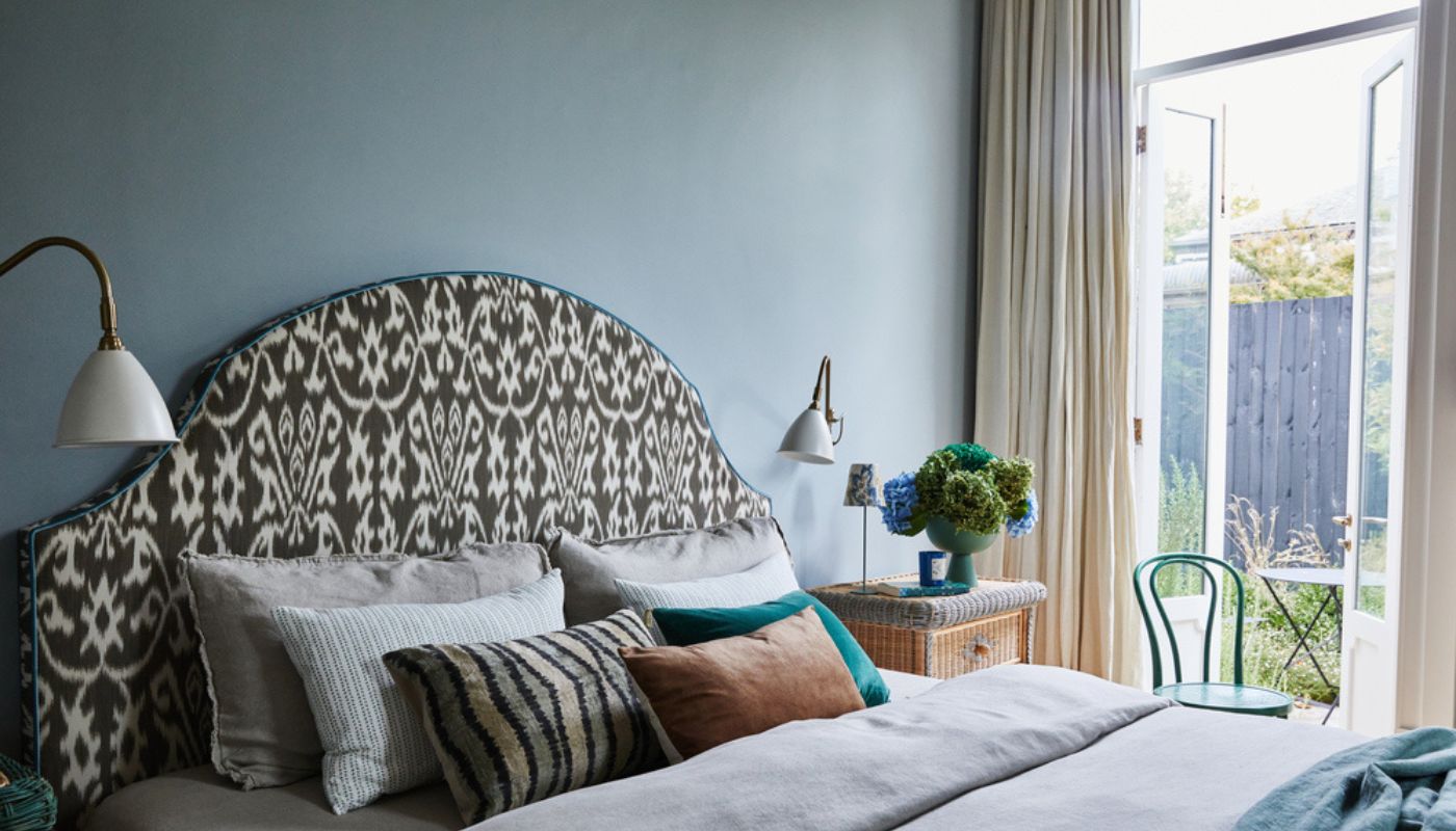 Blue bedroom with feature bedhead